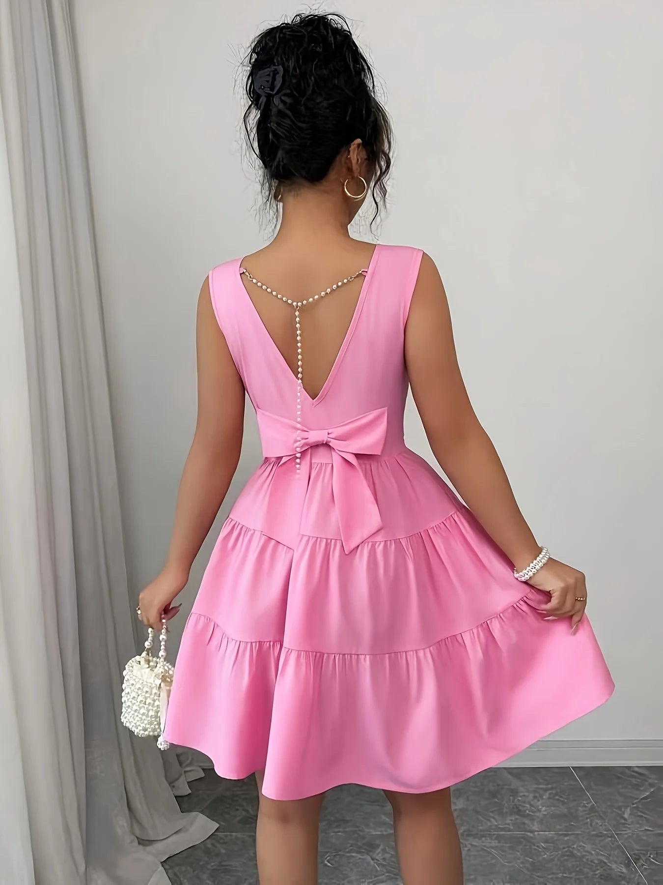 Elegant Sleeveless Midi Dress – Pearl Chain & Butterfly Knot Waist-Cinching